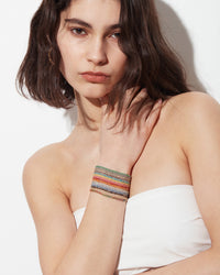 18k Yellow gold Multi wish lucky bracelet styled on model wrist