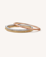 18k yellow, white and rose florentine frosted finish gold thick bangle set on white background