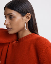 Carolina Bucci Small Drop Hoop Earrings, Florentine Finish 18k white gold, worn on female model 