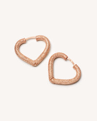 18k rose florentine frosted finish gold cuore huggies earrings on white background