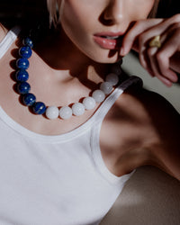 Bowery Downtown necklace including Lapis lazuli and White agate semi precious spheres styled with white vest