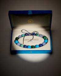 East village downtown necklace including Lapis lazuli, amazonite, Chalcedony and Malachite semi precious spheres, with sky coloured enamel spheres presented in a blue velvet box
