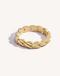 Closed, 18k yellow gold EveryDay bracelet with Patinato segments, Florentine Finish frosted gold, on white background