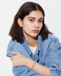 18k yellow forte got lucky florentine frosted finish gold fiore single earring modelled with 18k yellow florentine frosted finish gold 1885 links bracelet