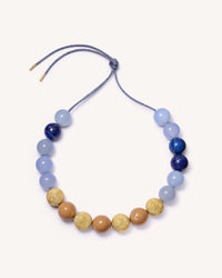 Greenwich village downtown necklace including Chalcedony and Lapis lazuli semi precious stones, camel coloured enamel spheres and 18k yellow gold florentine frosted finish spheres