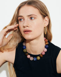 Alphabet city downtown necklace presented around model's neck