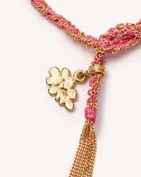 Close-up, 18k yellow gold lucky dream necklace with cloud charm on white background