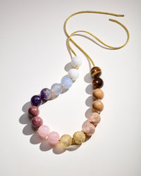 Meatpacking downtown Necklace with White agate, Chalcedony, Amethyst, Rhodonite, Rose quartz and Tiger's eye semi precious spheres, with camel enamel spheres and 18k yellow and rose gold florentine finish sphere