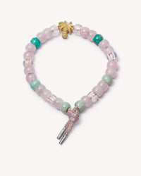 Palme beach forte beads bracelet with heather pink coloured lurex cord w/18k white gold caps and 18k yellow gold florentine frosted finish palm tree bead