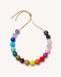 Soho downtown necklace including amethyst, chalcedony, lapis lazuli, amazonite, malachite, unakite, tiger's eye, rhodonite, rose quartz, white agate, snowflake obsidian and hematite semi precious spheres with sky, camel, lemon, terracotta, big apple red and flamingo coloured enamel spheres