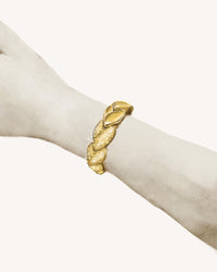 18k yellow gold EveryDay bracelet with Patinato segments, Florentine Finish frosted gold, on white background, worn on model's wrist
