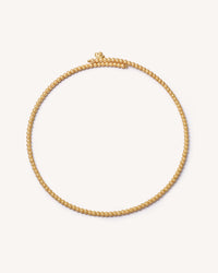 18k yellow gold open beaded choker on white background