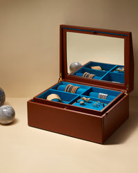 Pineider jewellery box showcasing Kiss bracelets, cuff bracelets cuore, thick and tutto per te rings, multi wish lazy lucky bracelet